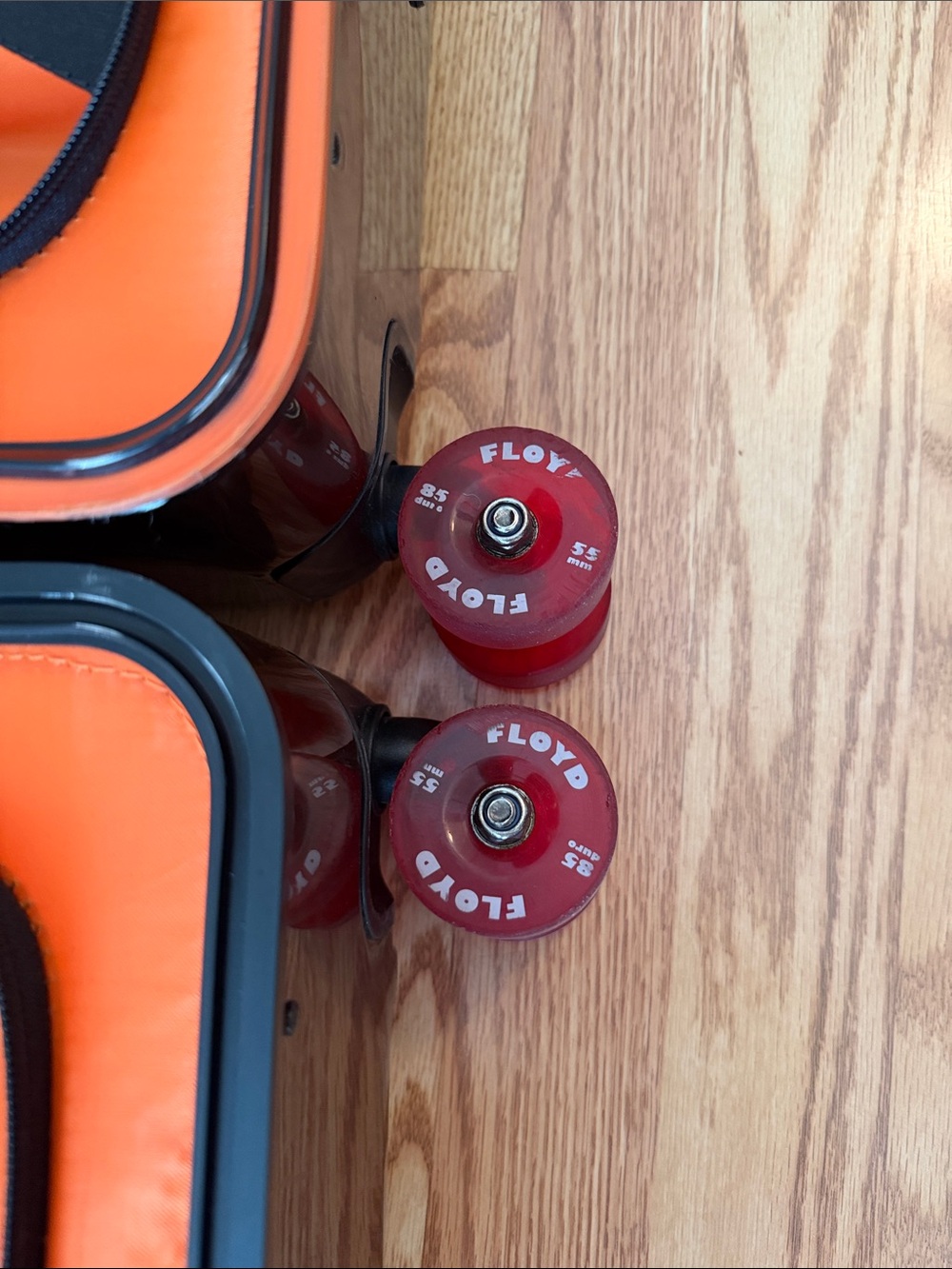 Floyd Brown Hardshell Suitcase with Bright Orange Interior and Red Wheels - Picture 12 of 17